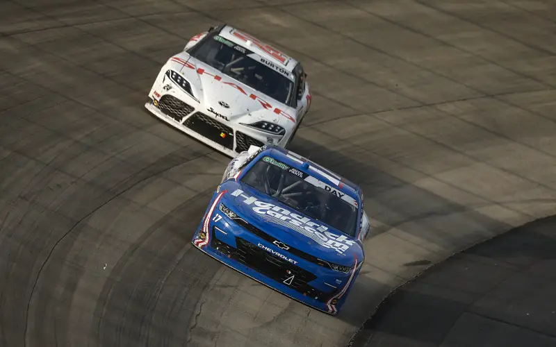 Corey Day uses the traffic to overtake Allgaier and win at Dover