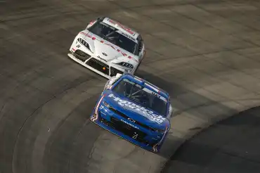 Corey Day uses the traffic to overtake Allgaier and win at Dover